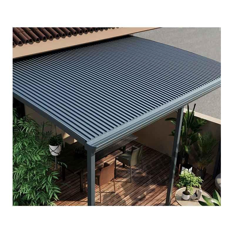 Modern outdoor patio with louvered awning, wooden deck, and garden furniture by Kings Awning