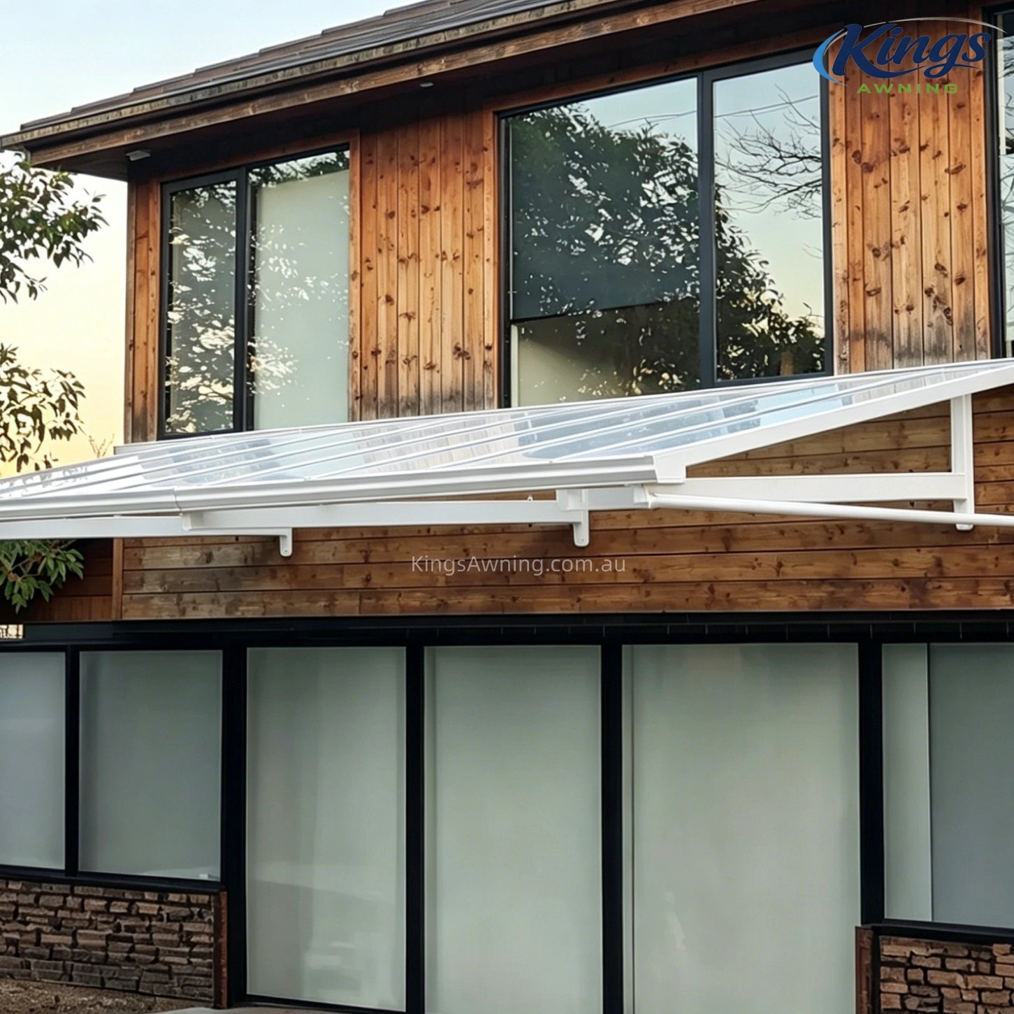 Wooden house with white awning canopy over balcony