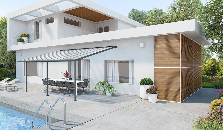 Modern aluminium patio cover awning by a poolside, attached to a contemporary white house